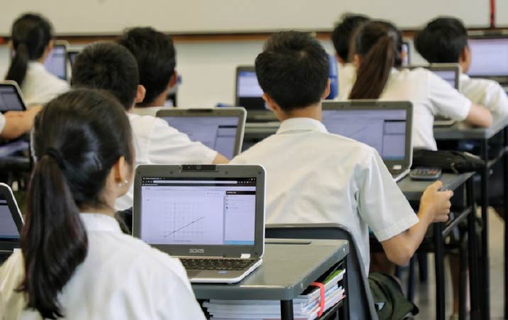 Education Department gives away laptops printers to cluster schools